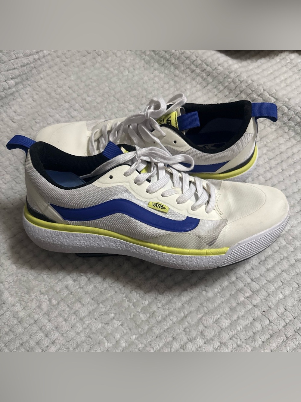 Vans White Low-Top Sneakers with Blue Stripe and Yellow Accent